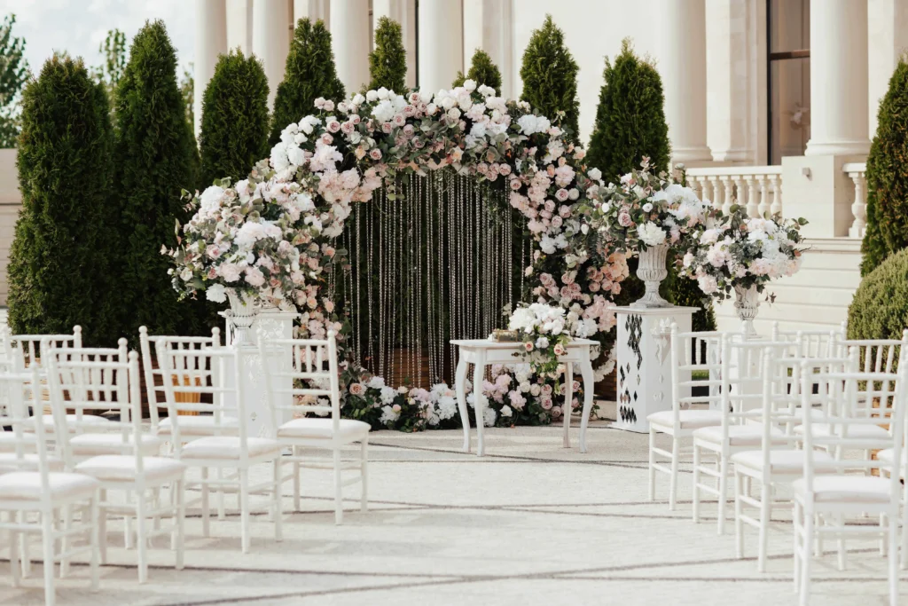 Modern wedding venue with an arch of fresh flowers
